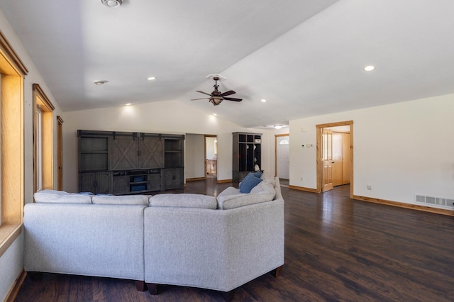 living area with lofted ceiling, a ceiling fan, dark wood finished floors, baseboards, and recessed lighting