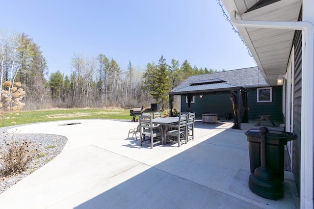 view of patio / terrace featuring a gazebo and outdoor dining space