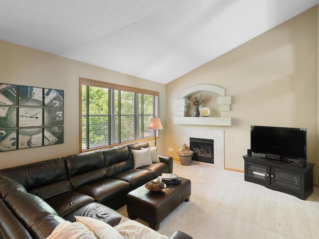living area featuring carpet, a fireplace, and lofted ceiling