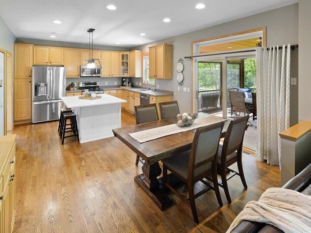 dining space featuring plenty of natural light, recessed lighting, and light wood-type flooring