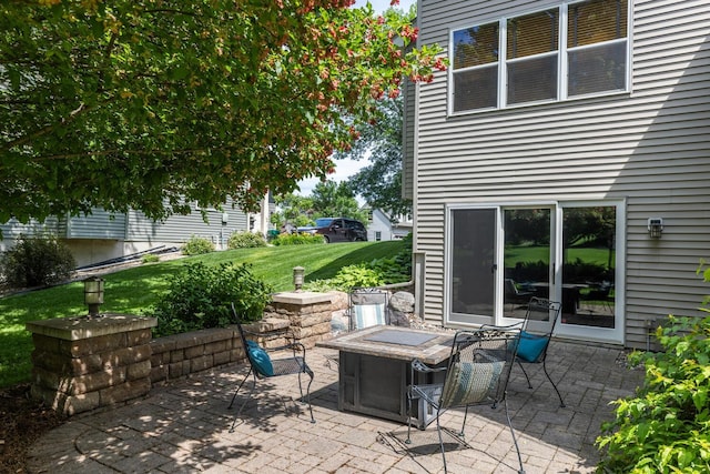 view of patio / terrace featuring an outdoor fire pit