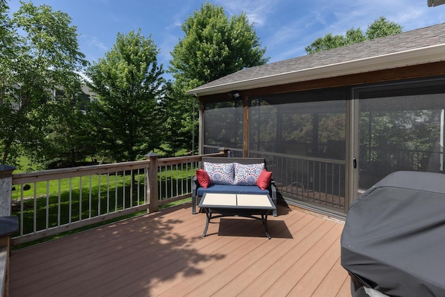 deck featuring area for grilling and a sunroom
