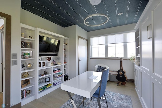 home office featuring light wood-style floors
