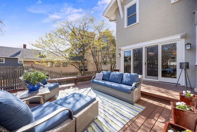deck with fence and an outdoor hangout area