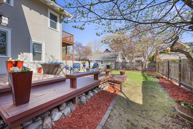 view of yard featuring a fenced backyard, a residential view, and a deck