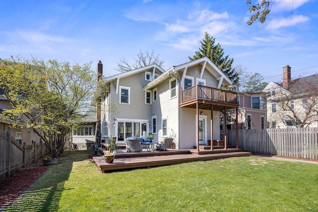 rear view of property with outdoor lounge area, a balcony, a fenced backyard, stucco siding, and a lawn