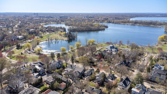 drone / aerial view with a water view and a residential view