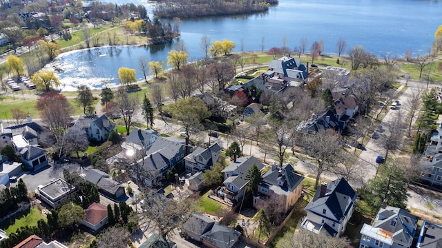 birds eye view of property featuring a water view and a residential view