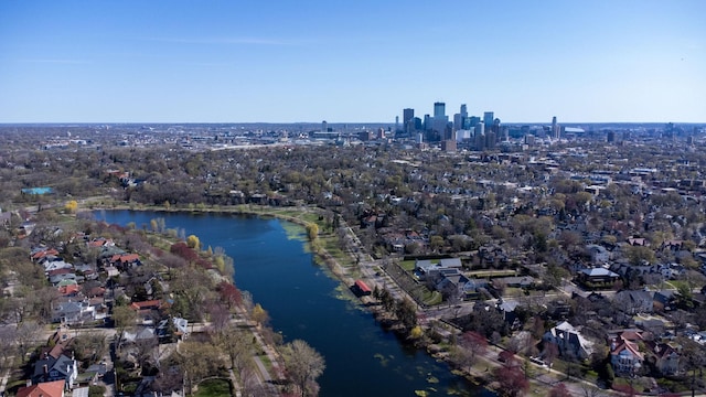 birds eye view of property featuring a water view and a city view