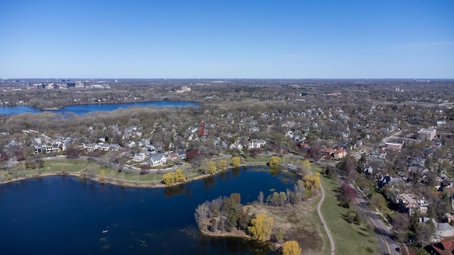 birds eye view of property featuring a water view and a residential view