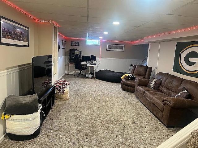 carpeted living room with wainscoting