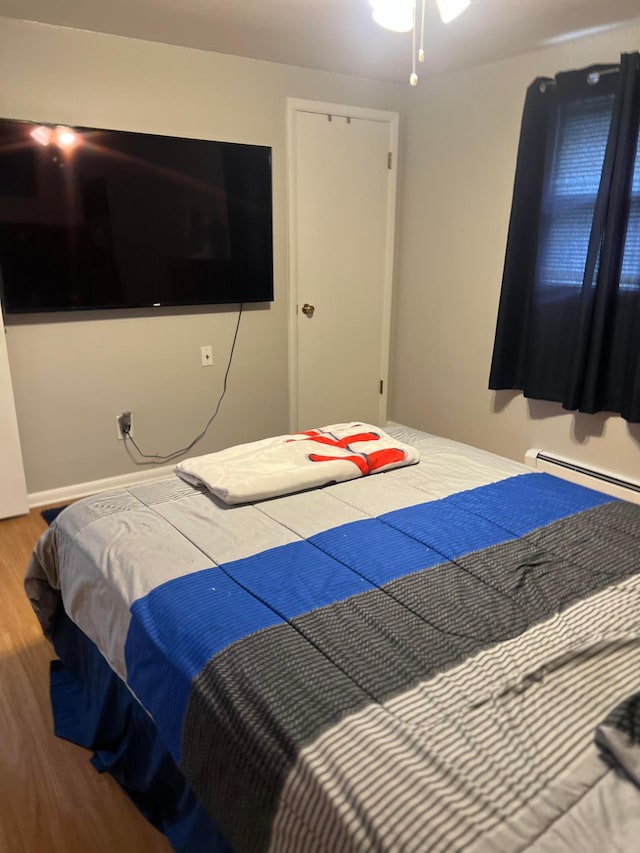 bedroom with wood finished floors