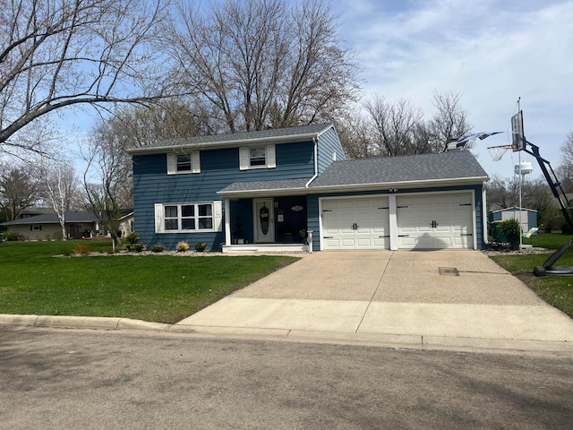 traditional-style house featuring concrete driveway, a shingled roof, a front yard, and a garage