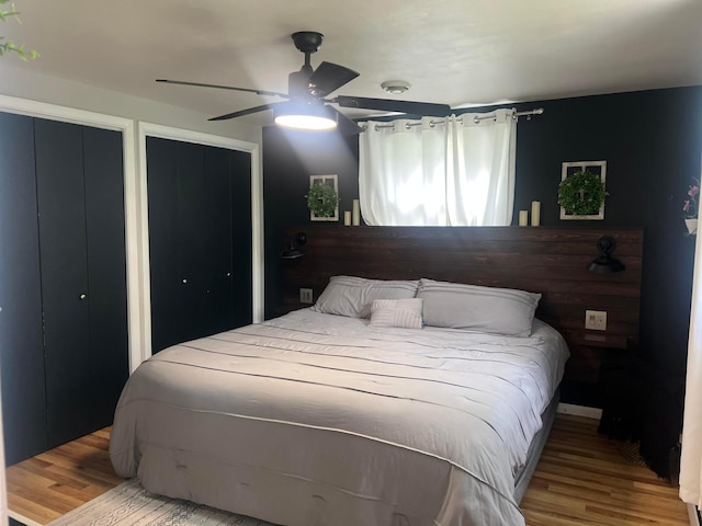 321 Meredith Rd, Albert Lea, MN 56007 - bedroom with two closets, wood finished floors, and ceiling fan