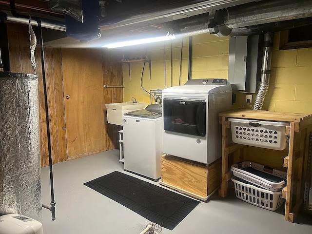 321 Meredith Rd, Albert Lea, MN 56007 - laundry room with washer and dryer, concrete block wall, and electric panel