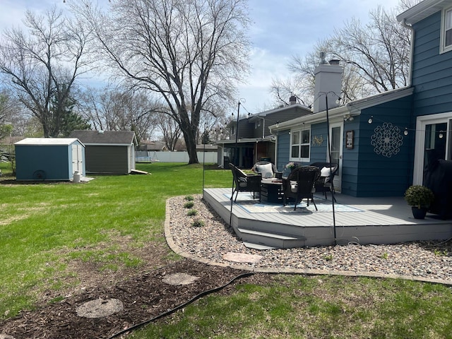 321 Meredith Rd, Albert Lea, MN 56007 - view of yard with a shed, a deck, and an outdoor structure