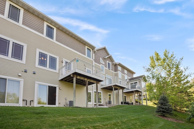 15601 Lilac Dr, Eden Prairie, MN 55347 - rear view of property with central air condition unit and a lawn