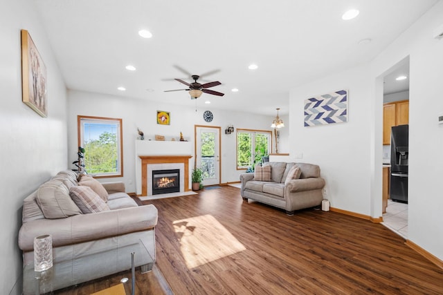 15601 Lilac Dr, Eden Prairie, MN 55347 - living room with recessed lighting, wood finished floors, ceiling fan, baseboards, and a tile fireplace
