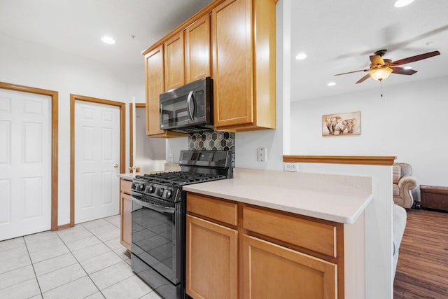 15601 Lilac Dr, Eden Prairie, MN 55347 - kitchen featuring gas range oven, a ceiling fan, light countertops, recessed lighting, and light tile patterned floors