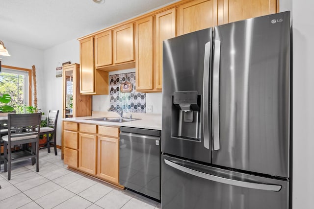 15601 Lilac Dr, Eden Prairie, MN 55347 - kitchen featuring appliances with stainless steel finishes, a sink, light brown cabinets, light countertops, and light tile patterned flooring