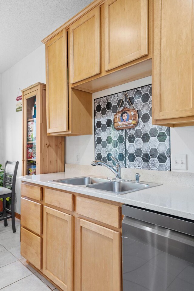 15601 Lilac Dr, Eden Prairie, MN 55347 - kitchen with stainless steel dishwasher, a sink, light brown cabinets, and light countertops