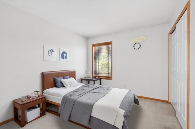 15601 Lilac Dr, Eden Prairie, MN 55347 - bedroom with a closet, light carpet, and baseboards