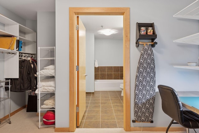 401 2nd St Unit 202, Minneapolis, MN 55401 - full bathroom featuring tile patterned flooring, toilet, and a bathing tub