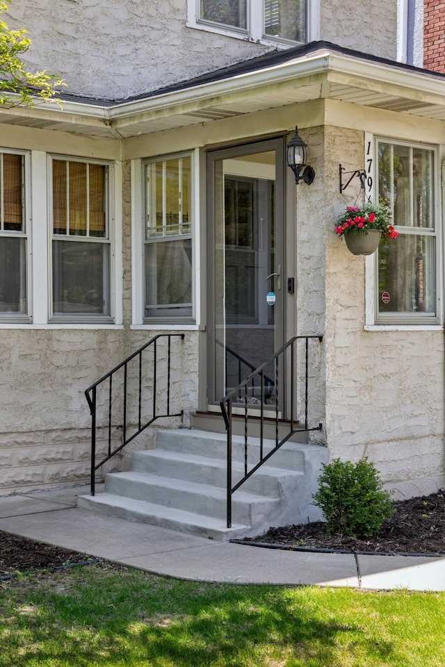 doorway to property featuring stone siding