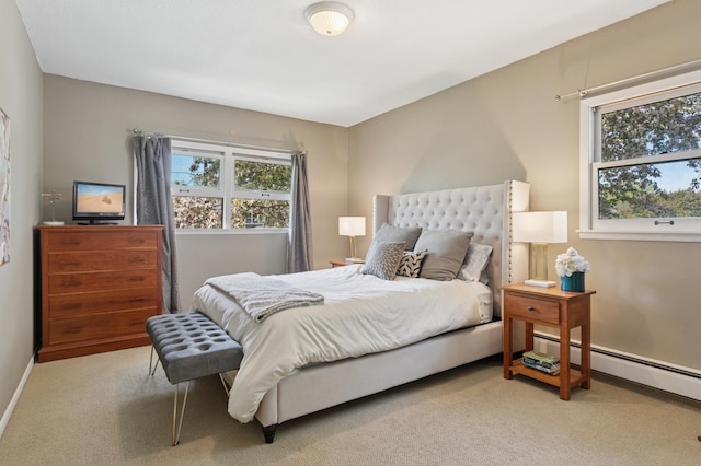 bedroom featuring carpet, a baseboard radiator, and baseboards