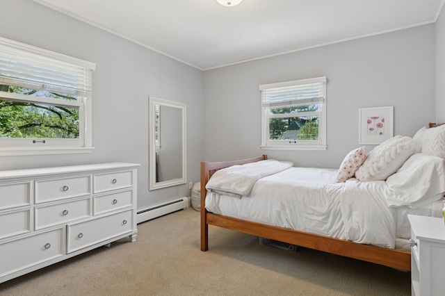 bedroom featuring a baseboard radiator, crown molding, and light carpet