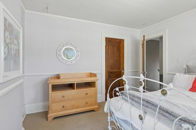 bedroom featuring crown molding, carpet flooring, and a textured ceiling