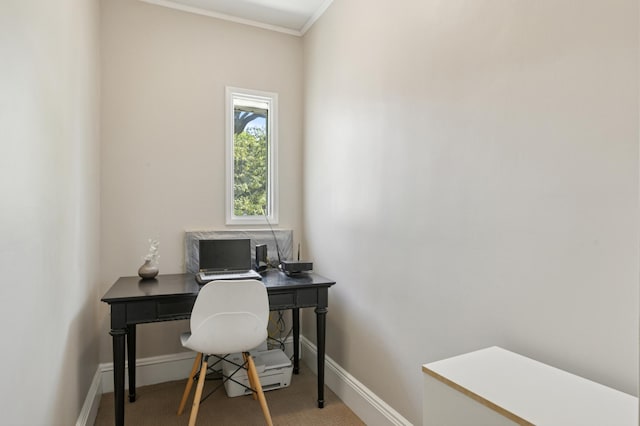 office area featuring light colored carpet, baseboards, and crown molding