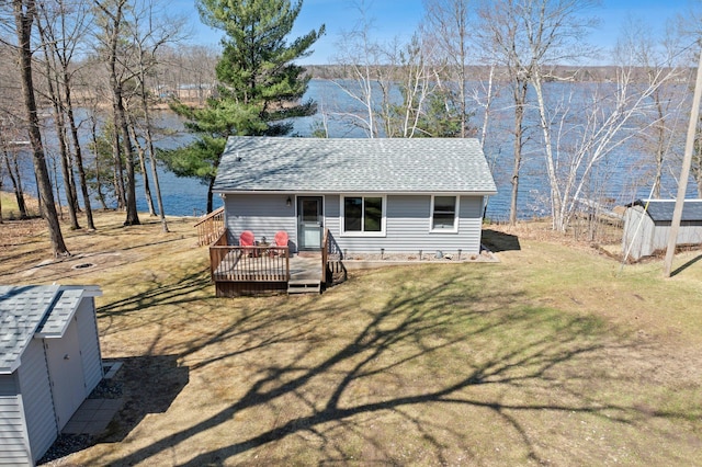 view of shed with a water view