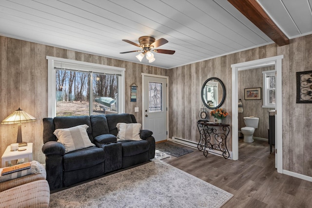 living room featuring wooden ceiling, baseboards, ceiling fan, and wood finished floors