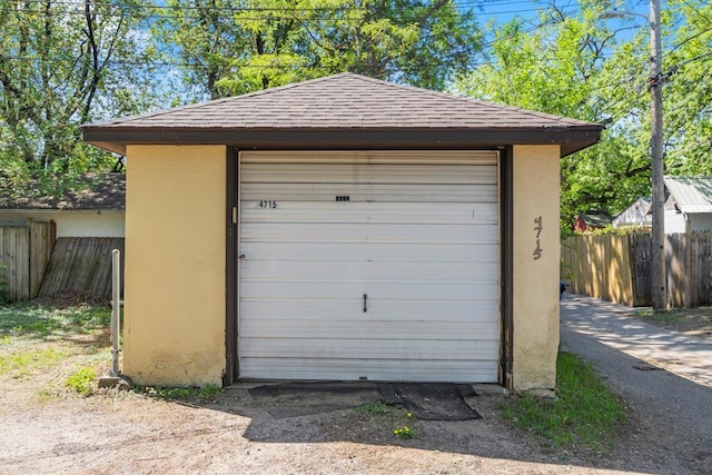 detached garage with fence