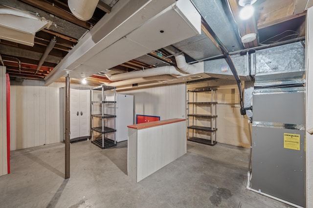 unfinished basement with heating unit