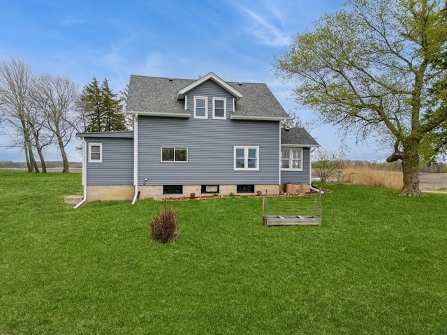 17492 460th Ln, Waterville, MN 56096 - rear view of house featuring roof with shingles and a lawn