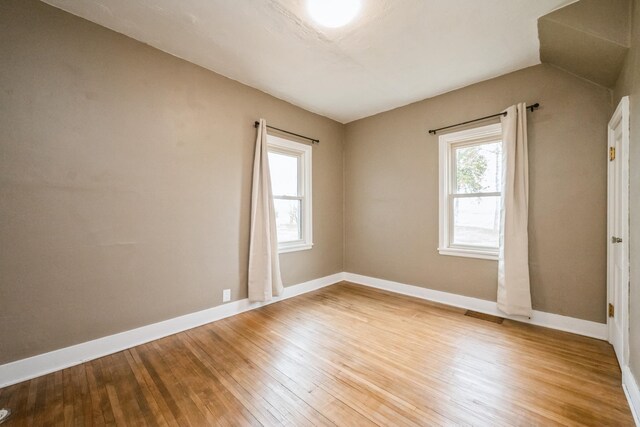 17492 460th Ln, Waterville, MN 56096 - empty room with light wood-style flooring, baseboards, and a healthy amount of sunlight