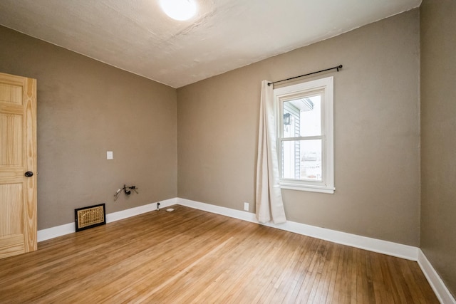 17492 460th Ln, Waterville, MN 56096 - spare room featuring baseboards and hardwood / wood-style floors