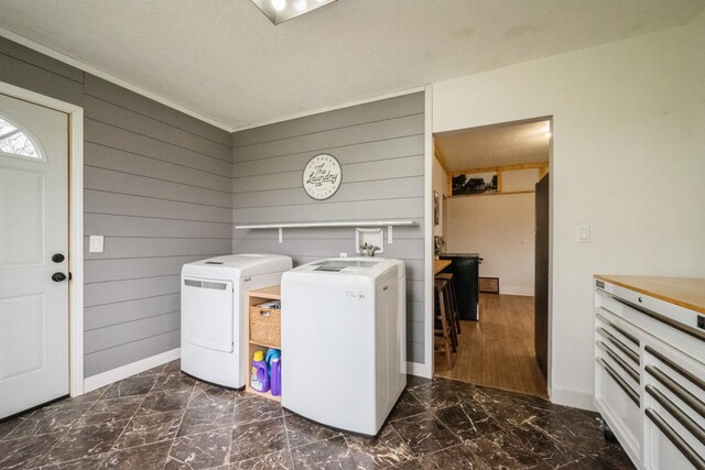 17492 460th Ln, Waterville, MN 56096 - laundry room featuring washing machine and dryer, baseboards, marble finish floor, wooden walls, and laundry area