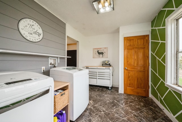 17492 460th Ln, Waterville, MN 56096 - clothes washing area featuring baseboards, marble finish floor, wooden walls, washer and clothes dryer, and laundry area