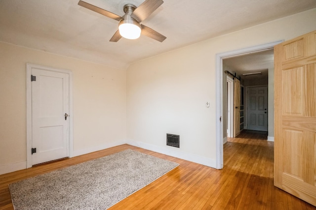 17492 460th Ln, Waterville, MN 56096 - unfurnished room with baseboards, ceiling fan, light wood-style floors, and visible vents