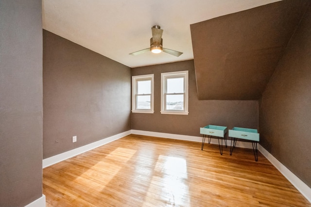 17492 460th Ln, Waterville, MN 56096 - additional living space featuring light wood-type flooring, vaulted ceiling, baseboards, and ceiling fan