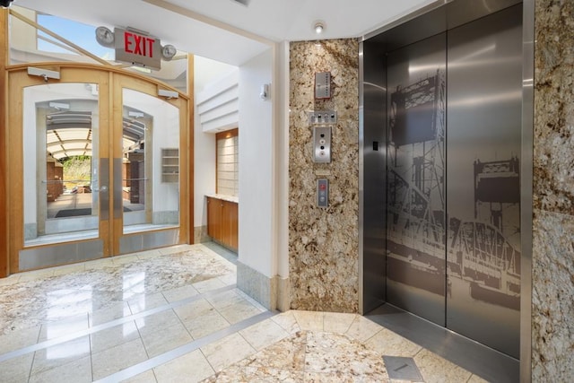 bathroom with elevator and french doors