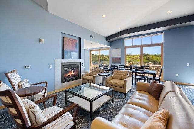living area with a fireplace, baseboards, visible vents, and recessed lighting