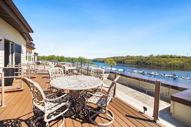 wooden terrace featuring a water view