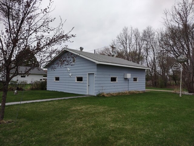 122 10th St, Madison, MN 56256 - view of home's exterior featuring a yard