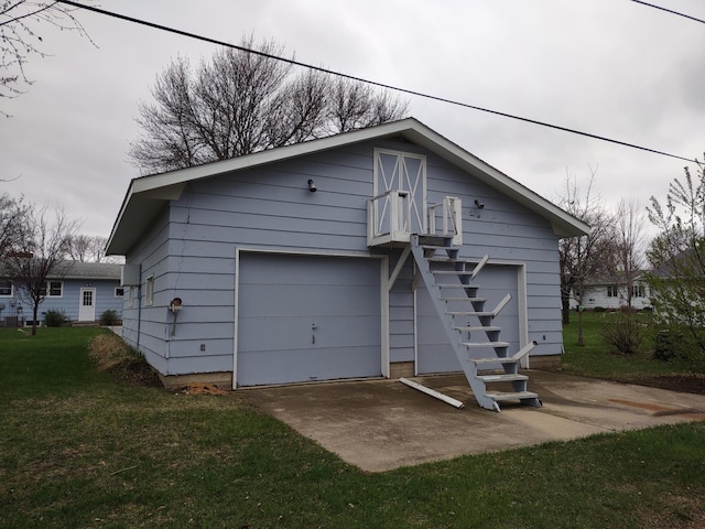 122 10th St, Madison, MN 56256 - view of front facade featuring a garage, a front lawn, and stairway
