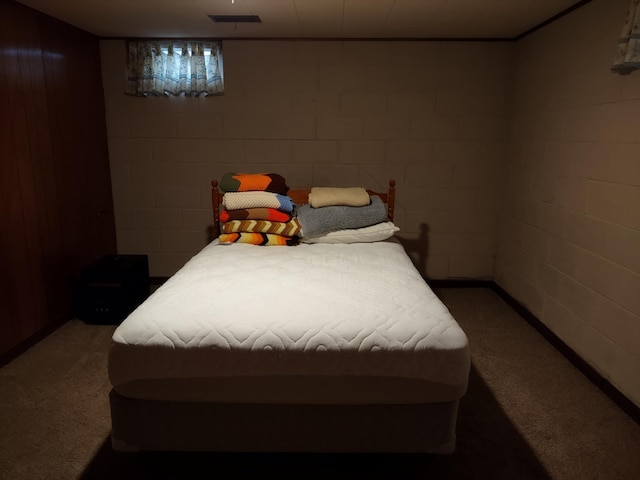 122 10th St, Madison, MN 56256 - carpeted bedroom featuring concrete block wall