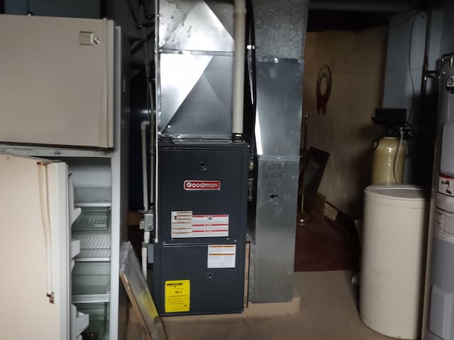 122 10th St, Madison, MN 56256 - utility room featuring heating unit